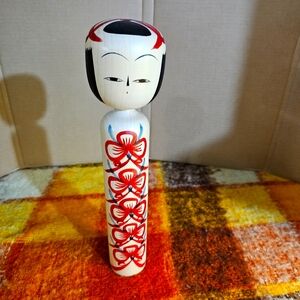Handcrafted Signed Kokeshi Doll with Red Floral Design